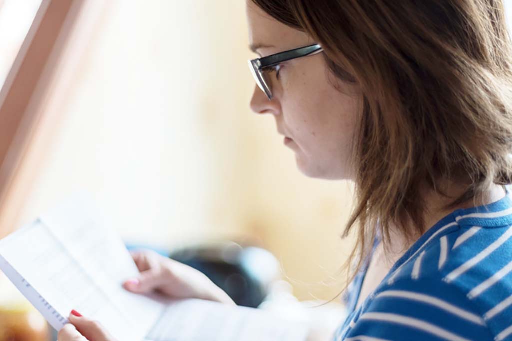 woman opening mail