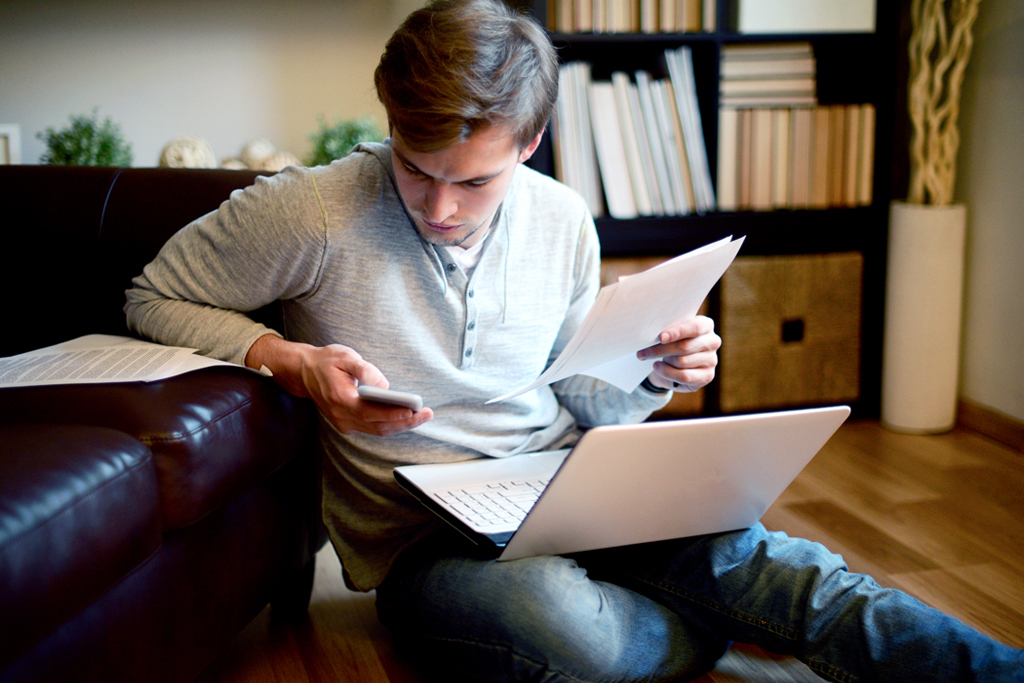 man looking at papers