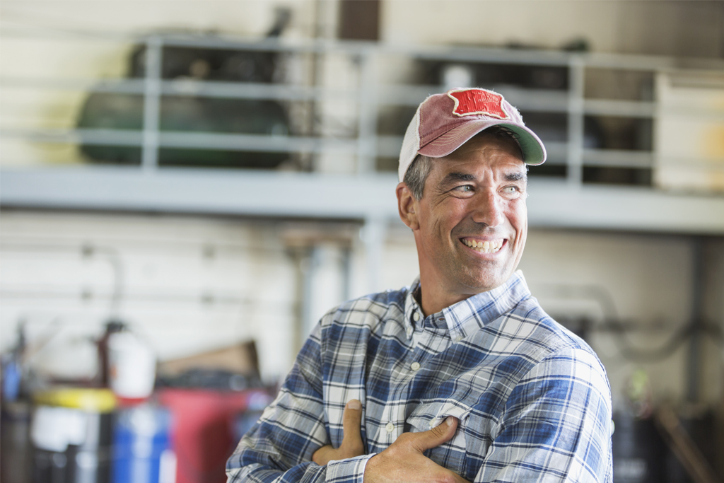 man with arms folded and smiling