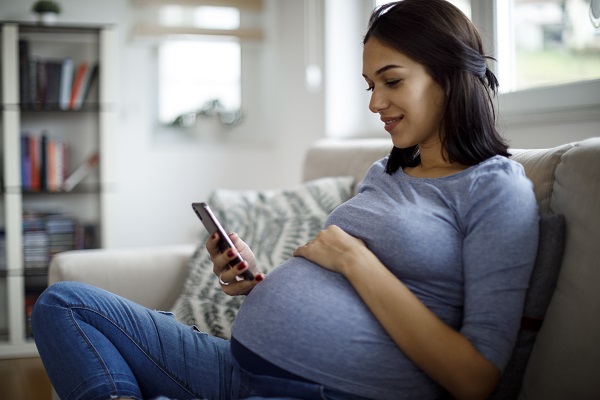 Pregnant woman on phone