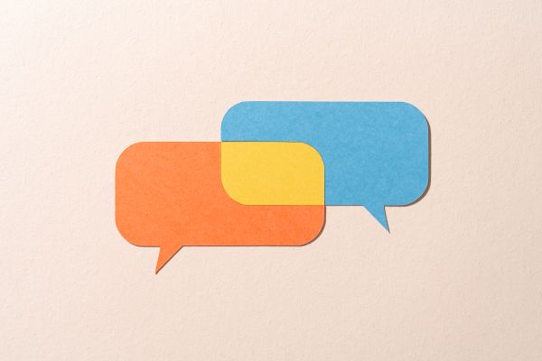 two overlapping speech bubbles conveying the concept of translation