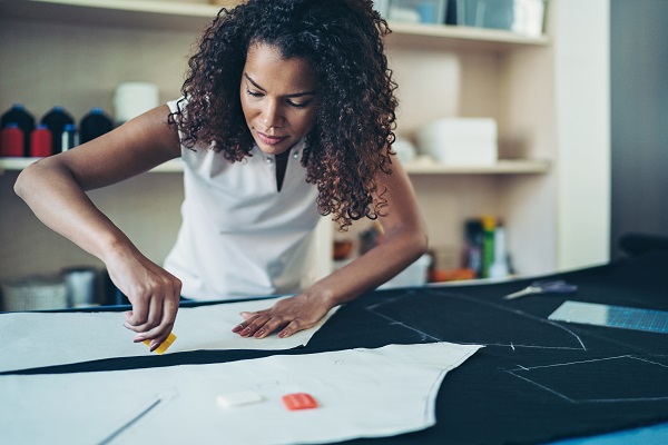 Woman mending a piece of fabric