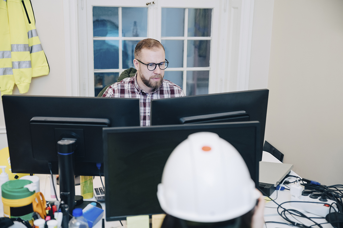 contractor working in his office on a computer