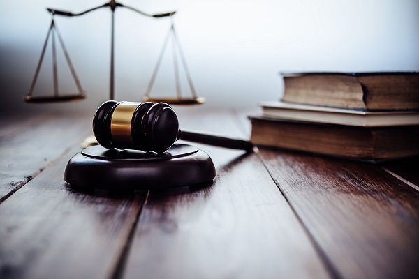 Close-up of gavel on table