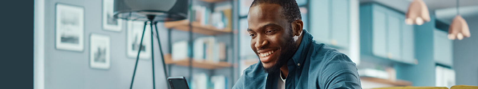 Man smiling at his phone