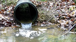 Water pouring out of pipe