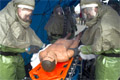 Members of the 177th Fighter Wing Medical Group demonstrate decontamination procedures for a non-ambulatory patient. Photo by Master Sgt. Don Taggart, 177FW/Multimedia Center.  (Click to enlarge)