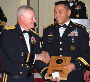 Staff Sgt. Juan Cuello (right) receives the Chief's 50 Award