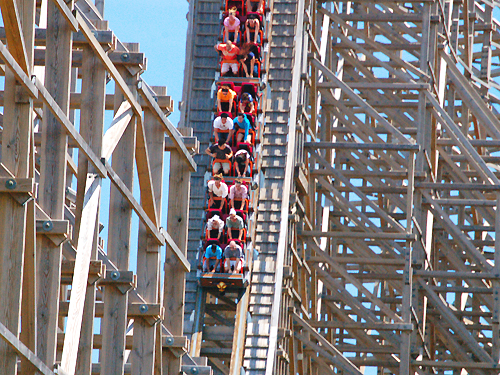 Riders take a steep plunge on one of the big wooden roller coasters at Six Flags Great Adventure, Jackson