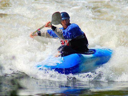 A kayak enthusiast shoots through the rapids on the Delaware River near Washington's Crossing