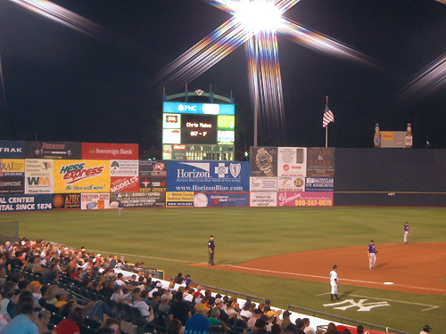 The lights glisten in the night sky at a Trenton Thunder baseball game at the waterfront district