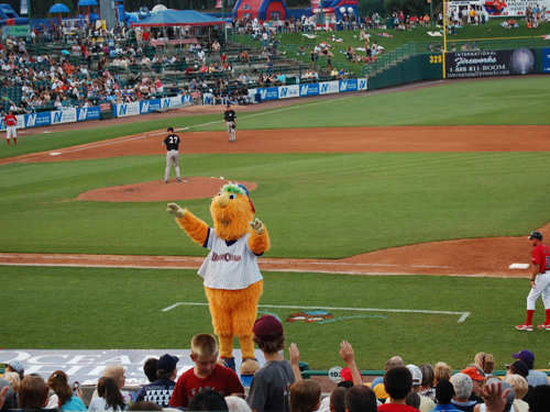 Buster,the mascot of the Lakewood Blue Claws Minor League team, entertains fans during a ball game