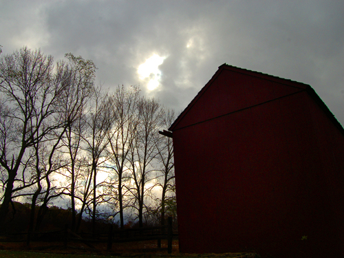 A barn is silhouetted against the winter sky at Jockey Hollow, Morris County