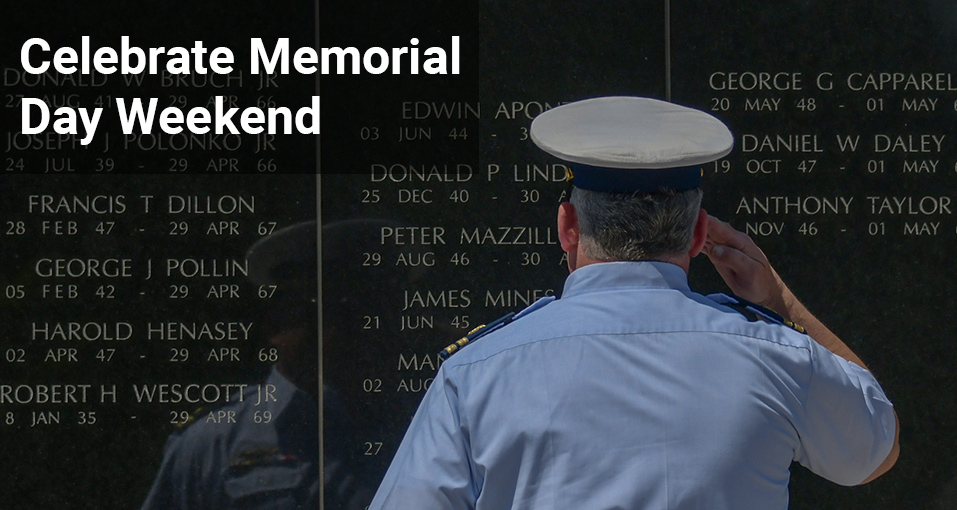 Man saluting at vietnam veterans memorial in holmdel text reads celebrate memorial day weekend