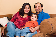 mom dad and boy on couch