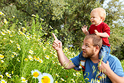 photo of Mom blowing bubbles for son