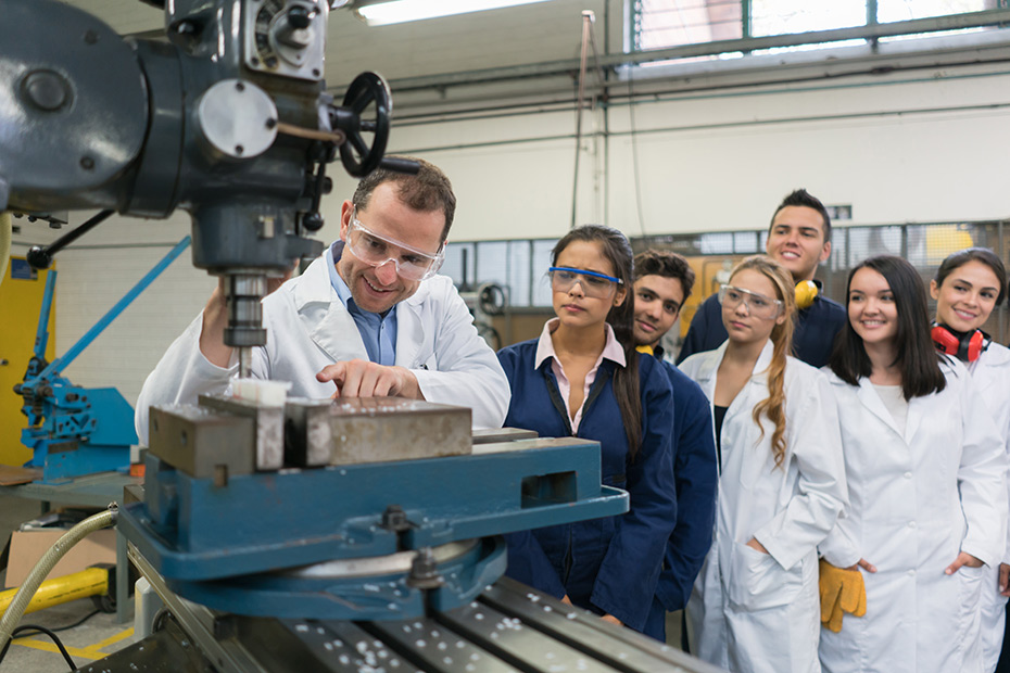 Educator and students in a trades workshop