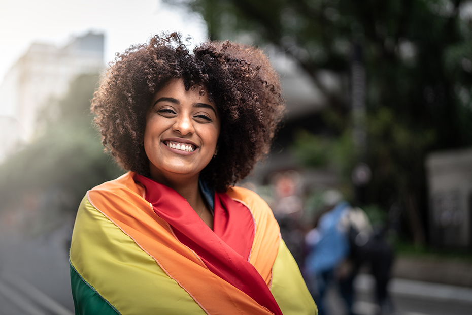 Person wrapped in LGTBQ+ flag : photo