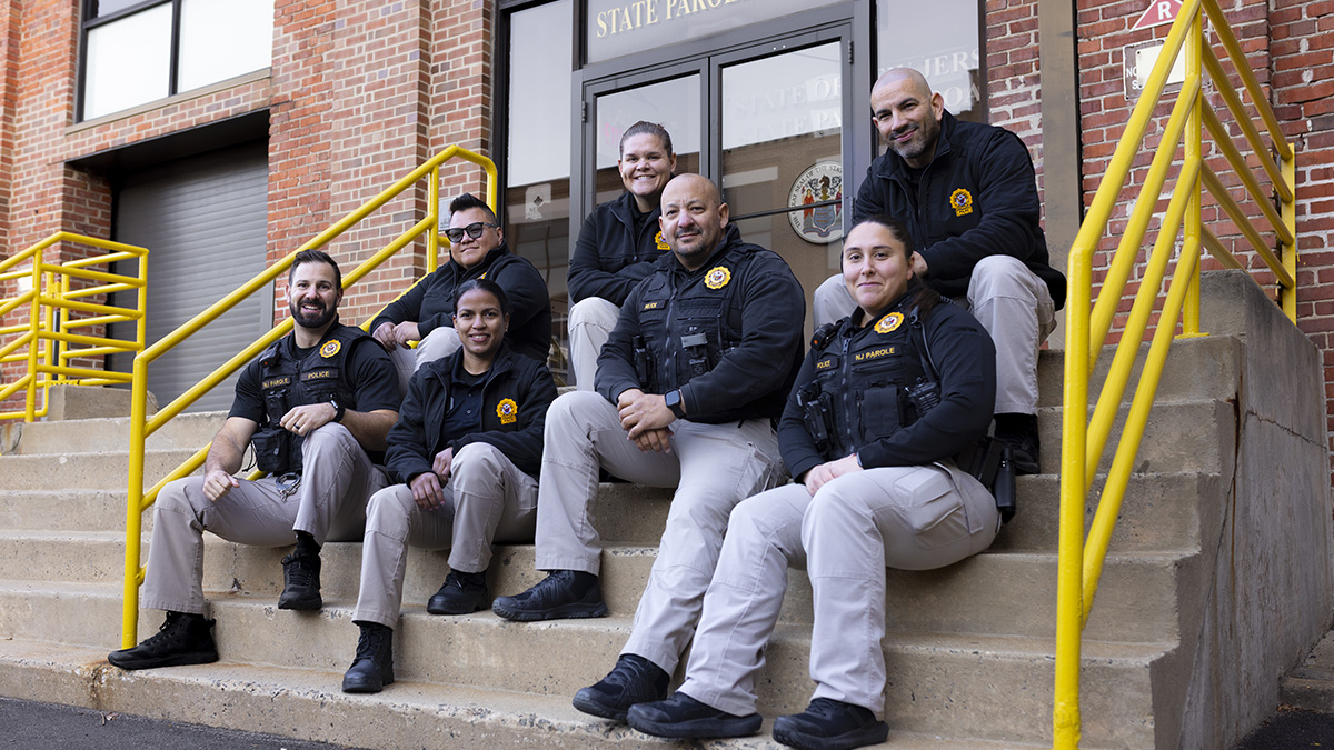 photo: parole officers sitting on the steps of the SPB building