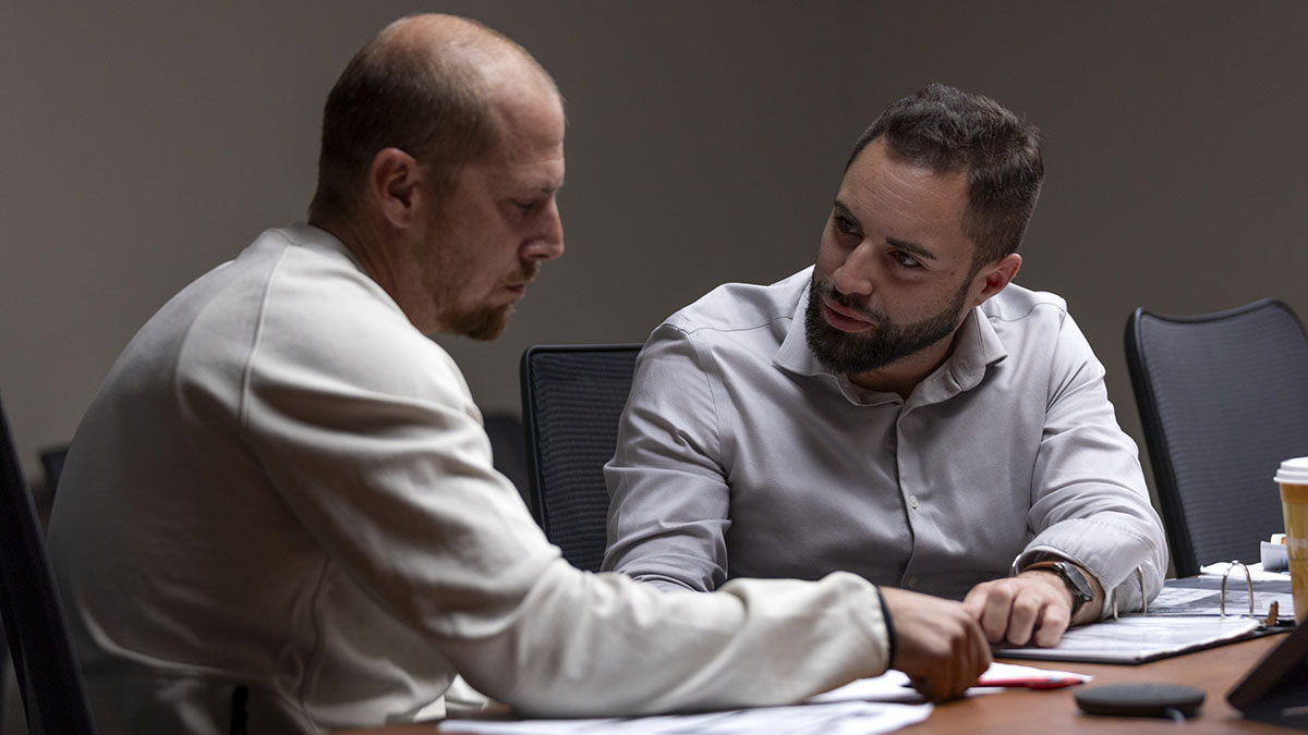 photo: two men in a discussion