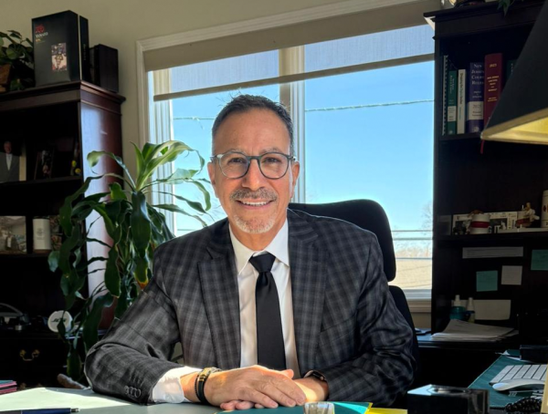 A. Todd Mayo sitting at a desk