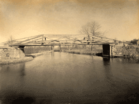 "Canal, showing Pompton Feeder, near Mountain View." [looking north up the Pompton Feeder from the main line of the canal; the bridge is the towpath bridge over the mouth of the feeder]