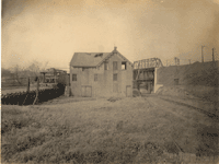 "Plane at Port Delaware, showing the Entrance to the Canal from the Delaware River, boarded up." [entrance arch boarded up; looking northwest]