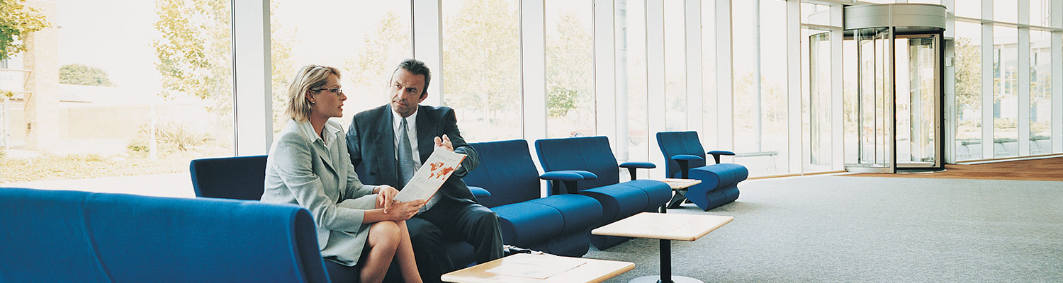 Professionals sitting and discussing a document