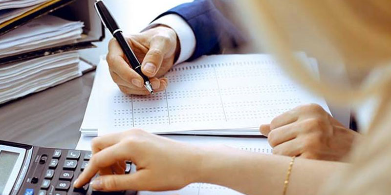 hands working on a document