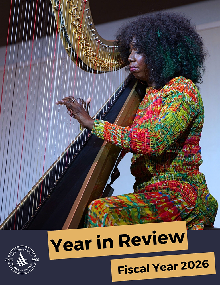 Woman playing the harp on stage