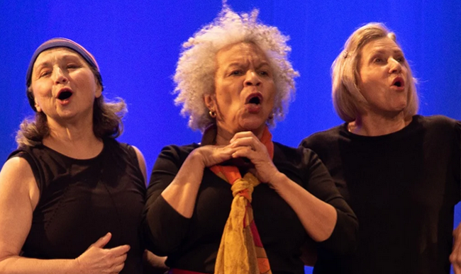Three people performing together