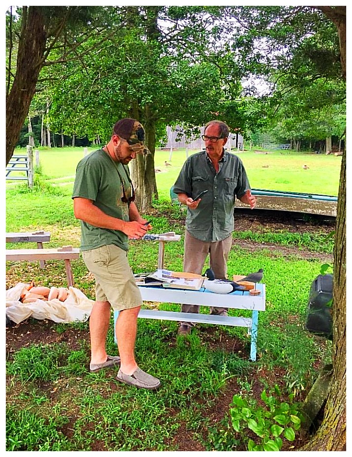 J.P. Hand and 1st year Apprentice - Alex Hascha working together on the start of a new project under the shade of the trees on Hand's farm