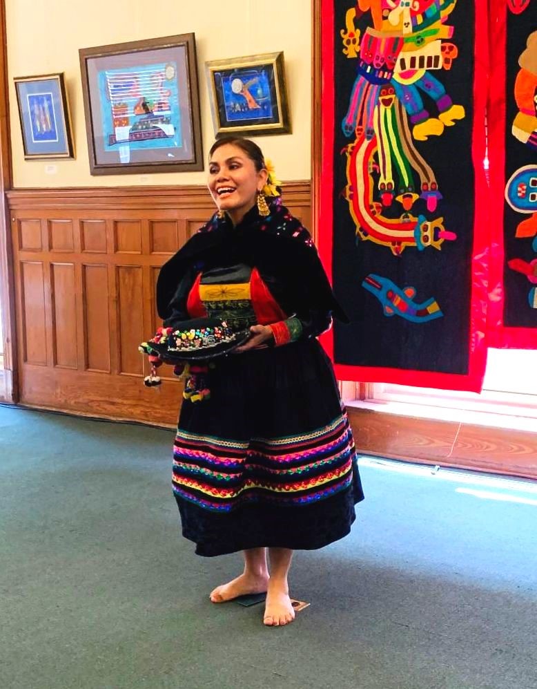 Rosa Carhuallanqui introducing the Peruvian Dance and Music Ensemble.