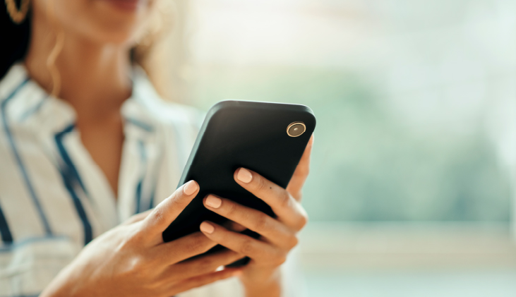 A woman holding a phone