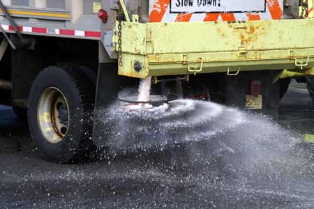 NJDOT truck spreads anti-icing material on a New Jersey road photo