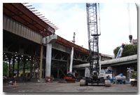 Steel framework is erected for placement above the newly constructed pier columns beneath the westbound 14th Street Viaduct photo.