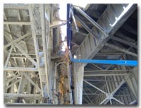Welding work is being done beneath the viaduct structure. Construction crews are currently working to build a new shoulder structure for the westbound 14th Street Viaduct photo.