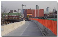 Vehicles travel on the newly constructed shoulder structure on the westbound 14th Street Viaduct. The shoulder structure provides an additional lane of travel for motorists as crews rehabilitate the center lanes of the roadway photo.