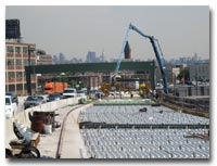 Crews install stay-in-place forms, shear studs, deck joint rails and reinforcing steel for the concrete deck pour on the 14th Street Viaduct photo.