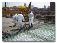 The deck and parapet reinforcing steel is installed and concrete deck pouring continutes on the 14th Street Viaduct photo.