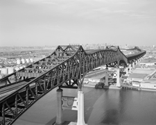 Looking northwest, the Pulaski Skyway rises over the Passaic River photo