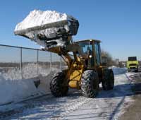 NJDOT Equipment Operator Scott Huda clears a bridge deck on Route 29 in Trenton following the first snowstorm of the season.