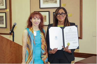 >Carol Cronheim, Cultural Trust Board of Trustees chairperson, accepts a proclamation from Governor Mikie Sherrill and Lieutenant Governor Caldwell recognizing the Trust’s 25th anniversary, presented by Assistant Secretary of State Adel Wilson.